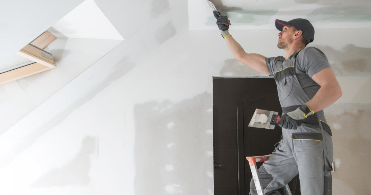 Handyman fixing drywall cracks and repainting in Los Angeles